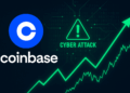 Logo de Coinbase junto a señal de ciberataque y gráfico de acciones proyectando rebote, destacando posible recuperación tras incidente.